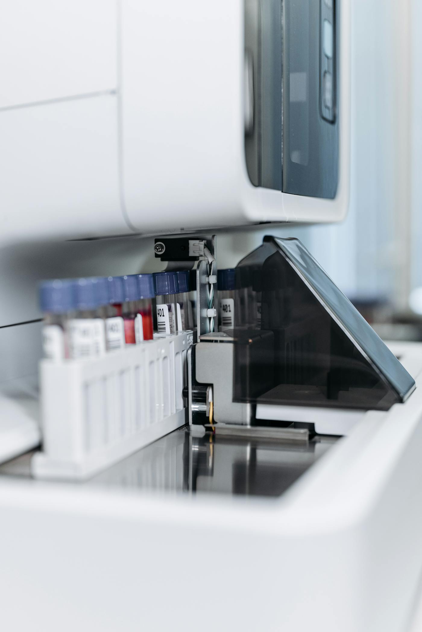 Automated laboratory equipment processing samples.